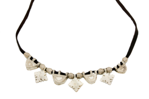 Single-strand silver necklace featuring handcrafted metal amulets on a dark brown leather strap, ethically made in Ethiopia.