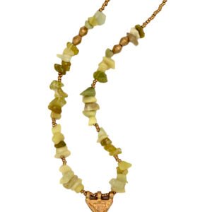 Handcrafted Ethiopian necklace featuring raw peridot crystal beads with an antique amulet pendant symbolizing protection and renewal.