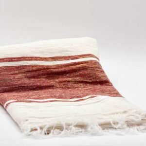 Handwoven Ethiopian cotton scarf in cream with deep crimson stripes, crafted by artisans in Ethiopia and Eritrea.